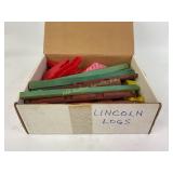 Lincoln logs pieces with roofs and chimneys