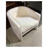 Upholstered White Tub Chair with Visible Wear