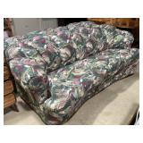 Floral Upholstered Curved Sofa with Abstract Desig