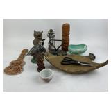 Carved tiki figure, glass lighthouse candle