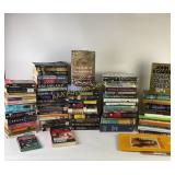 Books by James Patterson, John le Carre, and Sally