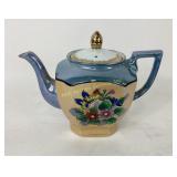 Ceramic Teapot With Floral Motif and Metallic Acce