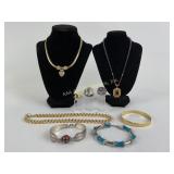 Costume Jewelry: gold tone necklaces and bracelet,