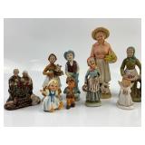 Porcelain old man and woman figures: enesco woman