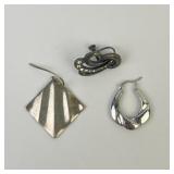.925 Sterling Silver un matched earrings: hoop
