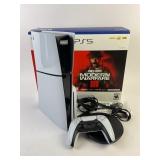 Sony PS5 with remote in box, lights up and makes