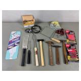 Saws, tack hammers, gun locks, padlocks