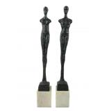Pair brutalist bronze statues on marble bases.