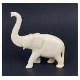 Antique carved elephant figurine, natural