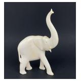 Large antique elephant figure, natural material.