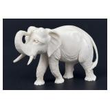 Antique carved elephant figurine, natural