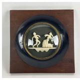 Carved bone shadowbox art in convex glass frame,