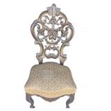 Wooden Dining Chair Featuring Ornate Carvings In