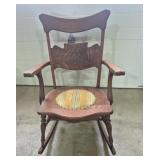 Oak Rocking Chair Featuring A Carved Crest Rail &