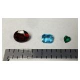 Loose gemstones - garnet, aquamarine, emerald