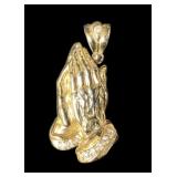 Sterling praying hands pendant with white stones.
