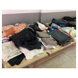 Clothing Items Including Sweaters, Pants, Jackets