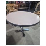 Round Cafe Table With A Light Pink Melamine Top &