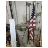 Garden trellace, American flag, light fixture, bin