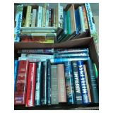 Books by Michael Crichton, Nora Roberts, Janet Eva