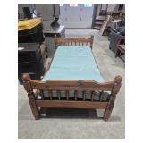 Wood Twin Bed Frame With Plastic Covered Mattress