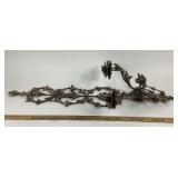 Ornate Cast Metal Wall Sconce With Floral Motif