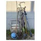 Yard tools: Shovels, rakes, lawn chairs, hoes