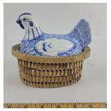 Delft blue style porcelain hen on a nest with