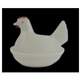 White milk glass hen on a nest with painted comb
