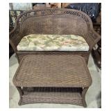 Brown Wicker Couch With Floral Seat Pad