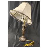 Bronze tone table lamp with beaded shade