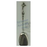 Shovel sugar spoon, .800 silver with cupid finial,