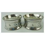 Pair silver plate napking rings with floral decor