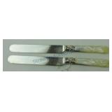 MOP handled lot of 2 dinner knives, carved handles