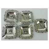 Set of 5 .800 silver ashtrays, floral border,