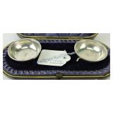 Pair of .800 silver salt cellars in original box,