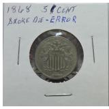 1868 Shield nickel, broke die error