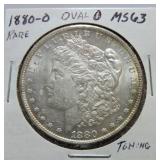 1880-O Morgan dollar MS63, oval 