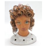 Head figure with copper wire hair and eye lashes,
