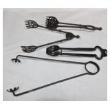 Lot of 4 cast iron tongs Lot of 4 cast iron tongs
