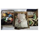 Box of doll clothes, toys, and assorted items