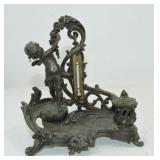 Metal inkwell/thermometer with cherub, 6"