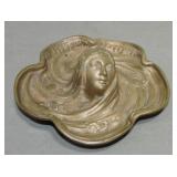 Cast iron advertising tray with maiden