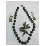 Jade necklace, brooch, and pair of earrings
