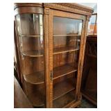 Beautiful  oak bow glass cabinet. Measures 75??