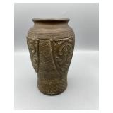 Stands 6" from top to bottom, the diameter is 3