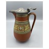 Stands 7 inches top to bottom, the diameter is 4