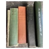 Vintage collection of books, some birds in their