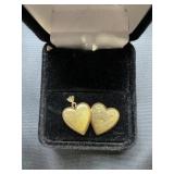 10 karat gold heart shaped locket engraved with a