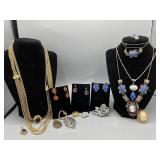 Collection of costume jewelry including slide